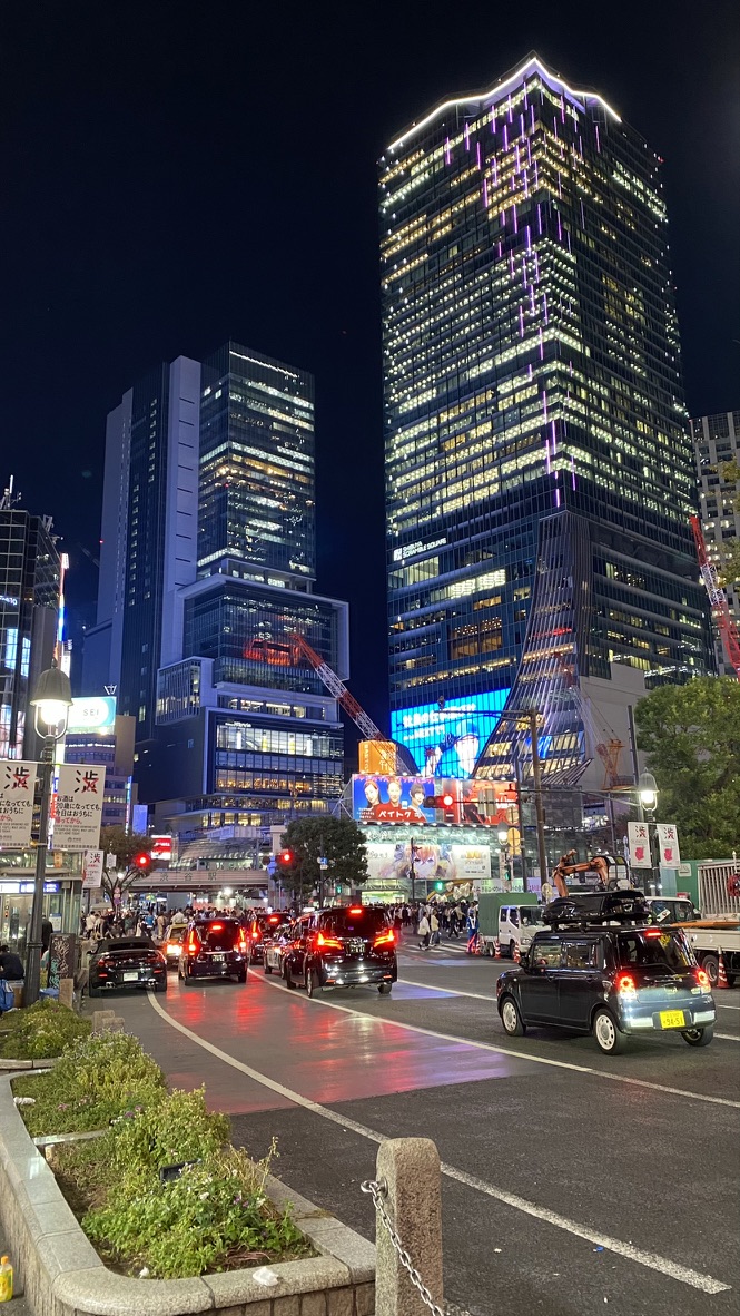 Traffic and high-rise lights around Shibuya Crossing at night