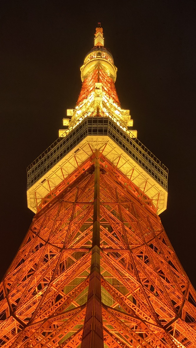 Tokyo Tower glowing orange against the night sky